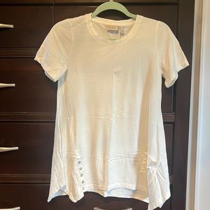 LOGO top. Size XS. Button and pocket detail with shark bite hem.